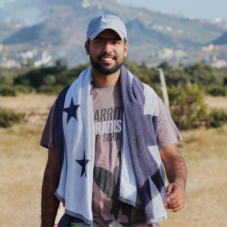 Kaveri Mehta, Lead Design Curator at CrimsonShorePath, reviewing corporate floral arrangements